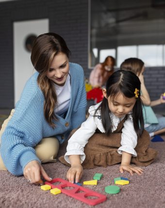 full-shot-teacher-helping-girl-learn
