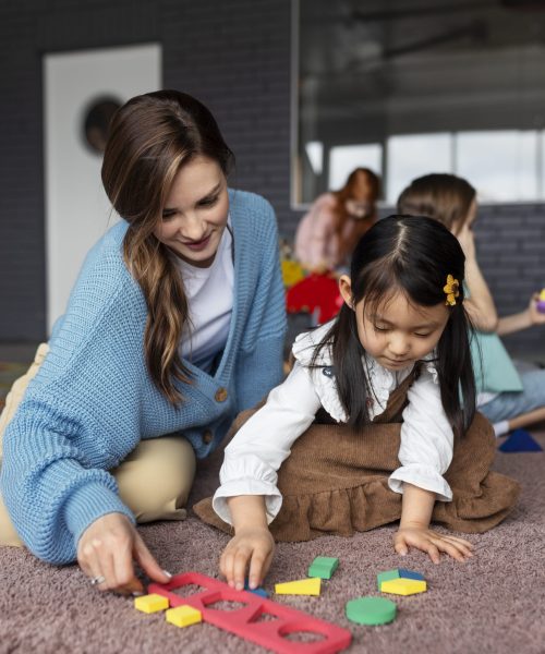 full-shot-teacher-helping-girl-learn